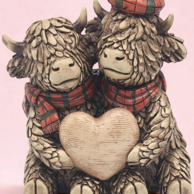 Cows With A Heart Ornament